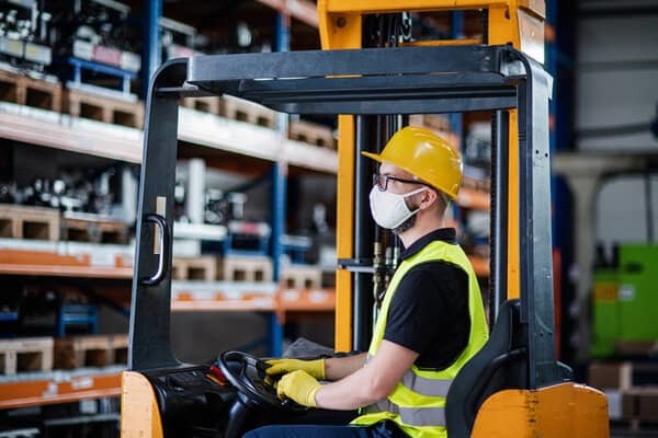 Man using forklift image Man using forklift image